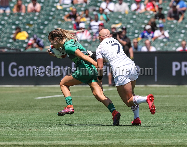2018RugbySevensFri-17.JPG - Aoife Doyle of Ireland is tackled by Heather Fisher (7) of England in the women's first round of the 2018 Rugby World Cup Sevens, July 20-22, 2018, held at AT&T Park, San Francisco, CA. Ireland defeated England 19-14.